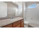 Bathroom featuring granite countertops, a tub-shower combo, and a modern sink at 2600 Reserve Ct, Erie, CO 80516