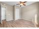 Cozy bedroom with hardwood floors, closet, and neutral paint, creating a serene atmosphere at 2600 Reserve Ct, Erie, CO 80516