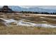 Scenic community featuring golf course with snow-capped mountains in the background at 2600 Reserve Ct, Erie, CO 80516