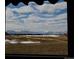 Scenic community featuring golf course with snow-capped mountains in the background at 2600 Reserve Ct, Erie, CO 80516