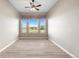 Bright dining area features windows offering a scenic view and contemporary ceiling fan at 2600 Reserve Ct, Erie, CO 80516