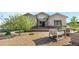 Inviting front exterior with stone accents, lush landscaping, and a manicured lawn at 2600 Reserve Ct, Erie, CO 80516