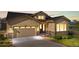 Beautiful front exterior with a two-car garage, inviting entrance, and manicured landscaping at 2600 Reserve Ct, Erie, CO 80516