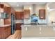 Modern kitchen with stainless steel appliances, granite countertops, and custom tile backsplash for a luxurious feel at 2600 Reserve Ct, Erie, CO 80516