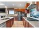 Gourmet kitchen equipped with stainless appliances, granite counters, and scenic views through large window at 2600 Reserve Ct, Erie, CO 80516