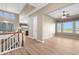 Open concept living space with hardwood floors and natural light from large windows at 2600 Reserve Ct, Erie, CO 80516
