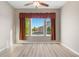 Living room with hardwood floors and large windows providing natural light at 2600 Reserve Ct, Erie, CO 80516