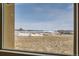 Scenic view from the home showcasing the lush greenery and distant buildings in the community at 2600 Reserve Ct, Erie, CO 80516