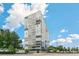 Striking high-rise building with modern glass facade against a blue sky backdrop at 3100 E Cherry Creek South Dr # 303, Denver, CO 80209