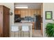 Efficient kitchen with stainless steel appliances, breakfast bar, and ample cabinetry at 3100 E Cherry Creek South Dr # 303, Denver, CO 80209