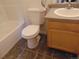 Cozy bathroom with a standard toilet, vanity, and tile flooring at 1405 Broadway St # 302, Boulder, CO 80302