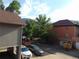 Serene view of the community showcasing buildings, lush greenery, and parked cars at 1405 Broadway St # 302, Boulder, CO 80302
