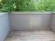 Enclosed deck with wood floors and a view of lush greenery and trees at 1405 Broadway St # 302, Boulder, CO 80302