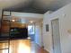 Bright kitchen with wood cabinets, black appliances, and a convenient breakfast bar, next to entry door at 1405 Broadway St # 302, Boulder, CO 80302