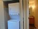 Convenient stackable washer and dryer located near the bathroom area at 1405 Broadway St # 302, Boulder, CO 80302