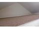 Close-up of the loft space, showing the carpeted floor and partial wall at 1405 Broadway St # 302, Boulder, CO 80302