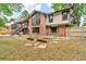 Two-story brick home with a lawn and some planters in the back yard at 1665 W 113Th Ave, Denver, CO 80234