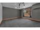 Finished basement room with neutral gray walls, carpeted floor, and a window for natural light at 1665 W 113Th Ave, Denver, CO 80234