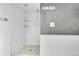 Contemporary bathroom with white subway tiles, mosaic floors, and chrome fixtures at 1665 W 113Th Ave, Denver, CO 80234