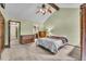 Spacious bedroom with a large window and walk-in closet boasts vaulted ceilings and an open layout at 1665 W 113Th Ave, Denver, CO 80234