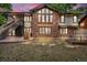 Back exterior of a two-story brick home on a small patch of lawn at 1665 W 113Th Ave, Denver, CO 80234
