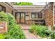 Inviting front entrance featuring elegant double doors, stone pathway, and beautifully landscaped surroundings at 1665 W 113Th Ave, Denver, CO 80234