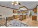 Bright kitchen with an island, modern appliances, light wood cabinets and a charming breakfast nook at 1665 W 113Th Ave, Denver, CO 80234