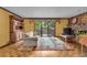 Relaxing living room with sliding glass doors to a patio and brick fireplace at 1665 W 113Th Ave, Denver, CO 80234