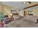 Spacious living room with vaulted ceilings, exposed beams, and comfortable seating arrangement at 1665 W 113Th Ave, Denver, CO 80234