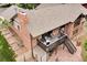 Back exterior with spacious deck, red brick, and stone patio, great for entertaining at 1665 W 113Th Ave, Denver, CO 80234