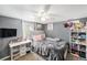 Inviting bedroom featuring a plush bed with a tufted headboard and a makeup vanity at 2562 E 90Th Pl, Thornton, CO 80229