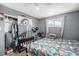 Cozy bedroom featuring bright bedding, dresser, and a closet with ample storage space at 2562 E 90Th Pl, Thornton, CO 80229