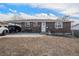 Charming brick home featuring a spacious carport and a well-manicured lawn on a sunny day at 2562 E 90Th Pl, Thornton, CO 80229