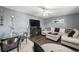 Cozy living room featuring a modern fireplace, a plush sectional sofa, and stylish decor at 2562 E 90Th Pl, Thornton, CO 80229