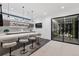 Stylish bar area with sleek countertops, modern stools, and glass-enclosed wine cellar at 267 S Clermont St, Denver, CO 80246