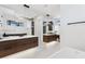 Sleek bathroom with dual vanities, modern fixtures, and ample lighting highlighting the minimalist design at 267 S Clermont St, Denver, CO 80246