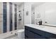 Modern bathroom features a glass shower with designer vertical tiling and modern fixtures at 267 S Clermont St, Denver, CO 80246