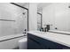Stylish bathroom features a shower-over-tub combination, modern vanity, and sleek black fixtures at 267 S Clermont St, Denver, CO 80246