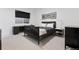 Contemporary bedroom features modern furniture, a desk, and monochromatic color scheme at 267 S Clermont St, Denver, CO 80246