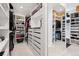 Spacious walk-in closet with custom shelving, drawers, and organized storage with a full-length mirror at 267 S Clermont St, Denver, CO 80246