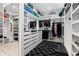 Organized walk-in closet features custom shelving, drawers, and ample storage space with a mirror at 267 S Clermont St, Denver, CO 80246