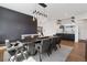 Open dining space featuring a sleek chandelier, modern decor, and a gray accent wall with a fireplace at 267 S Clermont St, Denver, CO 80246