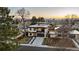 Modern home with beautiful landscaping, a driveway, and an upper-level balcony, captured from an elevated view at 267 S Clermont St, Denver, CO 80246
