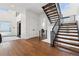 Bright foyer boasts hardwood floors, an open staircase with black metal railings, and a modern design with an elevator at 267 S Clermont St, Denver, CO 80246
