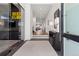 Entryway with a sleek design, a glass-walled office, and a view extending through the hallway at 267 S Clermont St, Denver, CO 80246