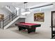 Basement game room features a pool table, modern decor, and recessed lighting at 267 S Clermont St, Denver, CO 80246