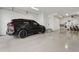 Spacious garage with epoxy floors and ample room for parking and storage at 267 S Clermont St, Denver, CO 80246