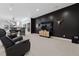 Modern living room featuring a large TV, comfortable seating, and unique decor at 267 S Clermont St, Denver, CO 80246