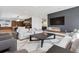 Open-concept living room featuring a sleek fireplace, modern lighting, and stylish furnishings at 267 S Clermont St, Denver, CO 80246