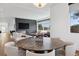 Open-concept living and dining areas featuring contemporary furnishings and fireplace feature wall at 267 S Clermont St, Denver, CO 80246